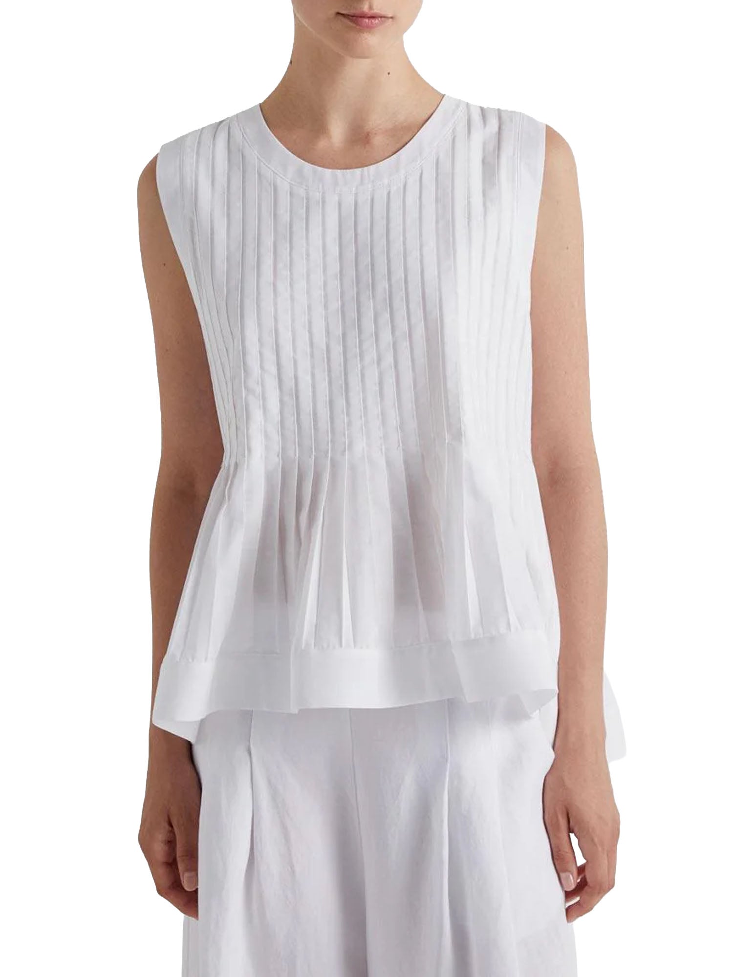 Meimei J. Blusa con Plisse al Fondo Bianco