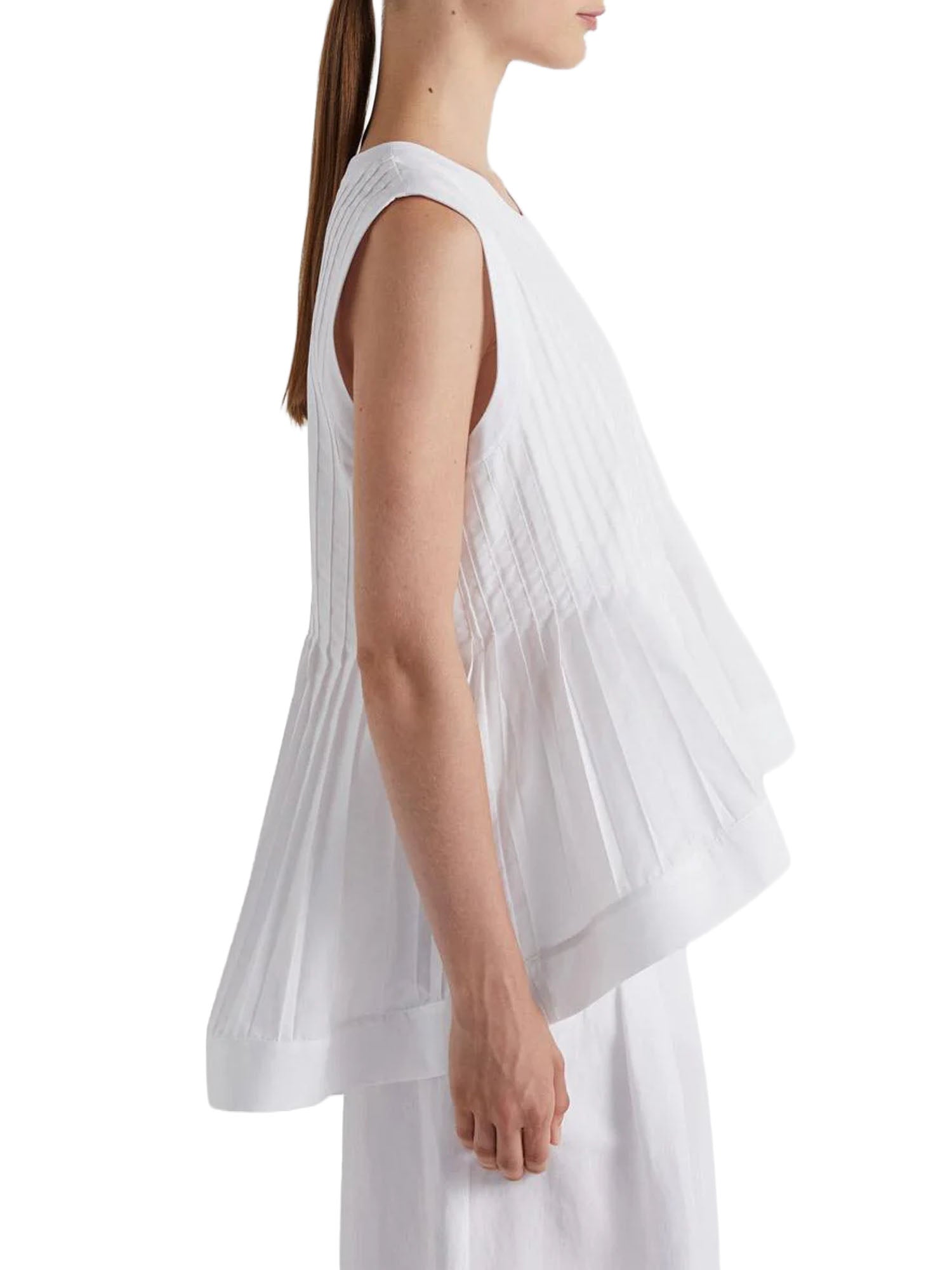 Meimei J. Blusa con Plisse al Fondo Bianco